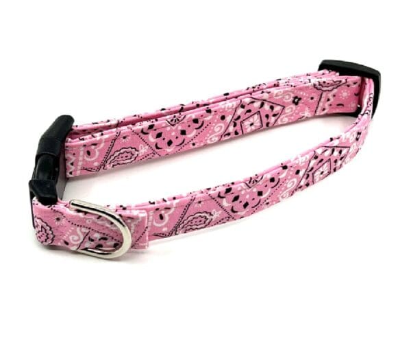 A pink bandana dog collar with a metal buckle.