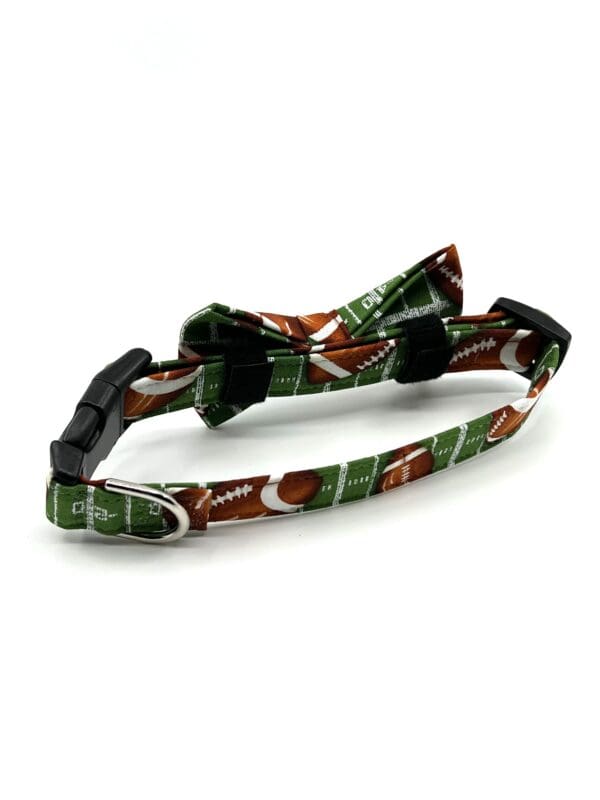 A dog collar with a football print on it.