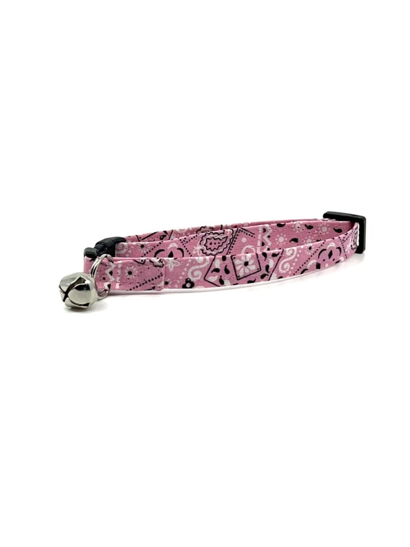 A pink cat collar with black and white paisley pattern.
