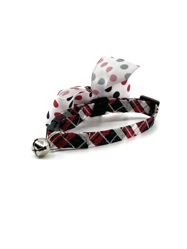 A cat collar with a bow.