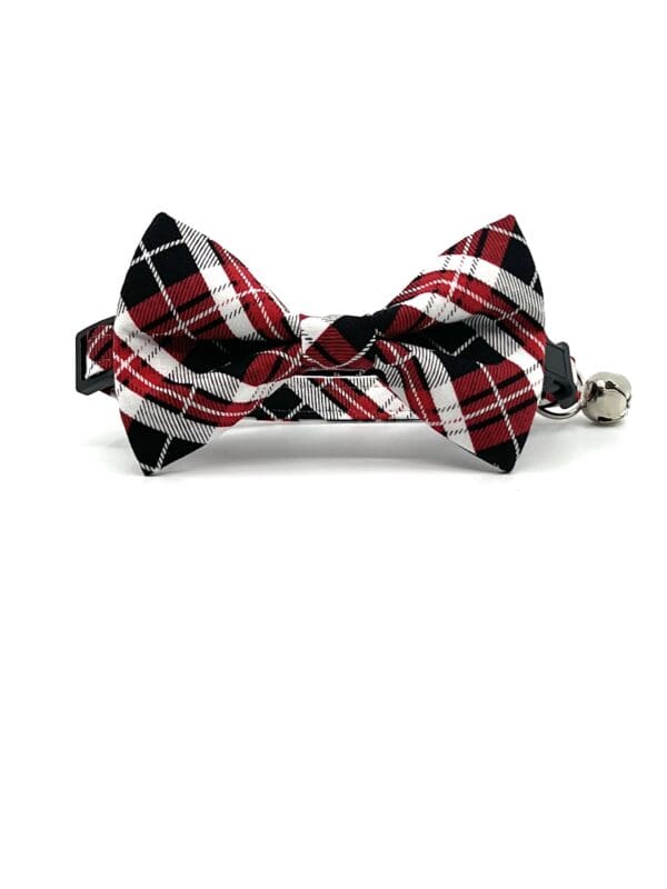 A black and red plaid bow tie on a white background.