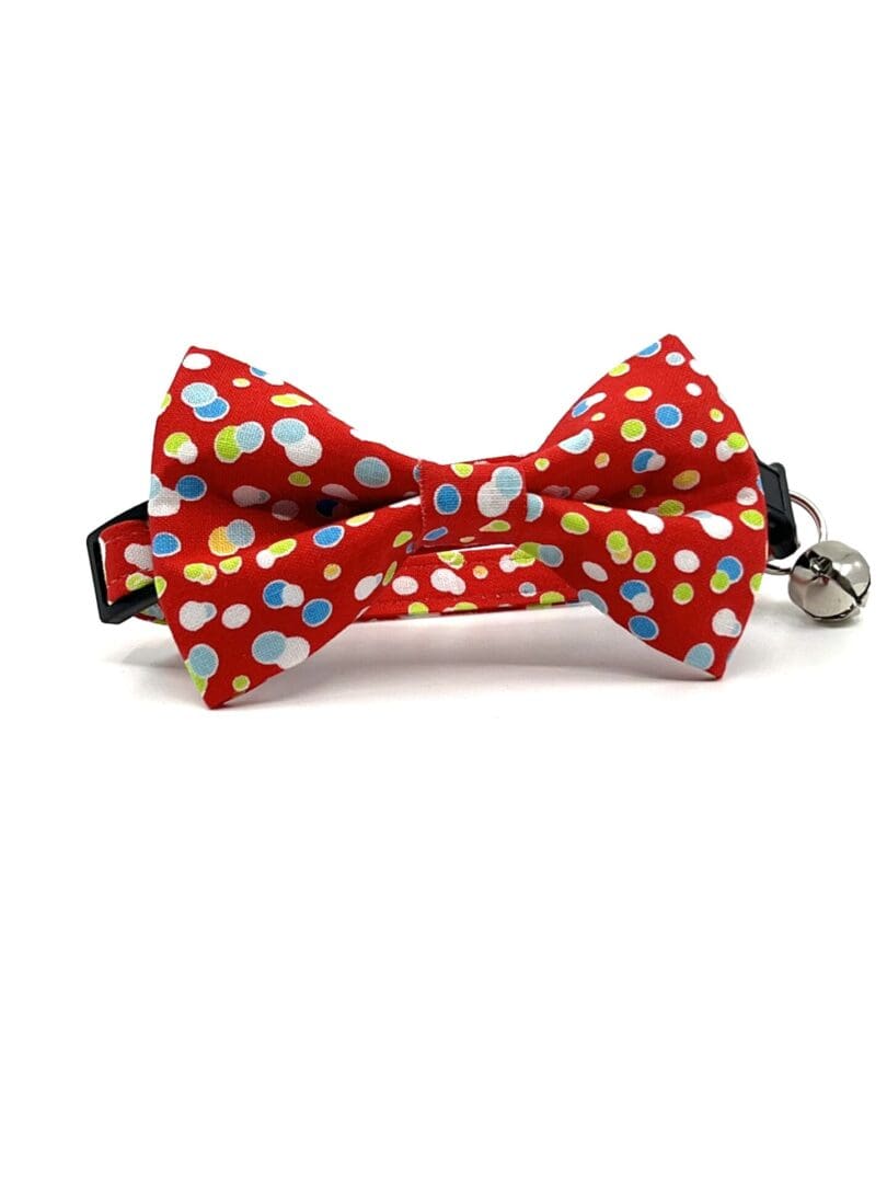 A red bow tie with polka dots on it.