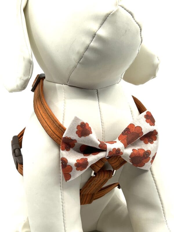 A stuffed animal wearing a bow tie.