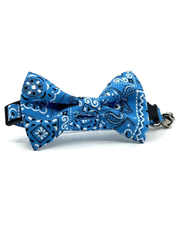 A blue bow tie with white and blue bandana.