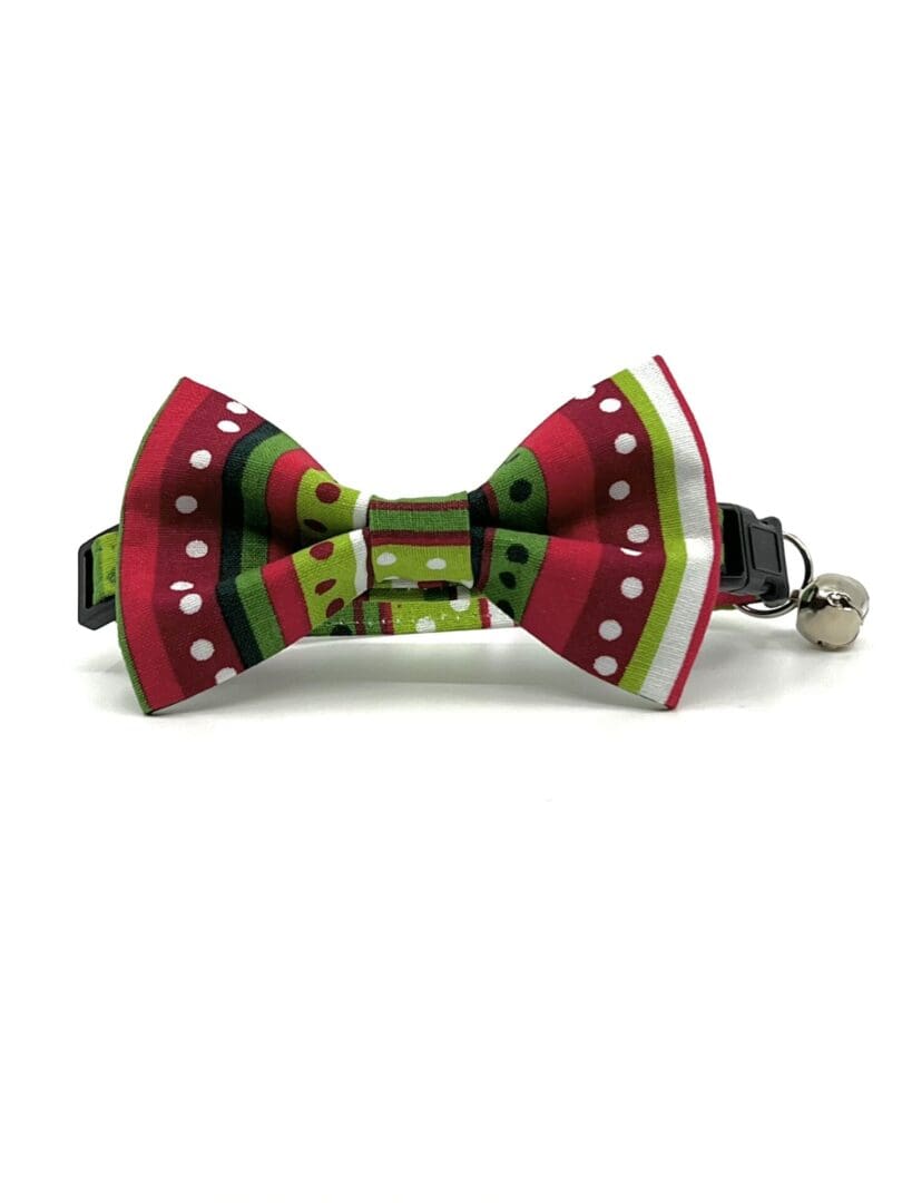A red, green and white bow tie with bells.