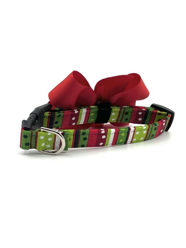 A dog collar with a bow on it.