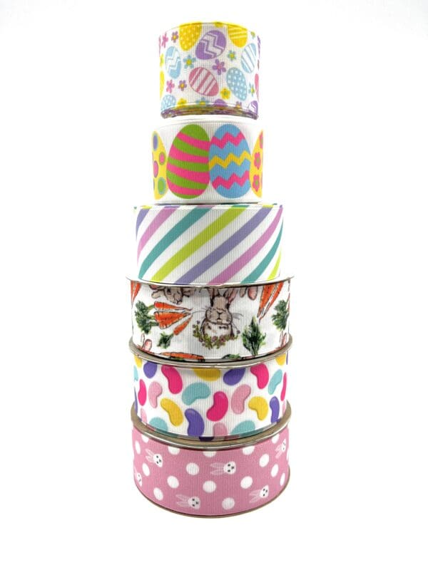 A stack of seven different colored ribbons.