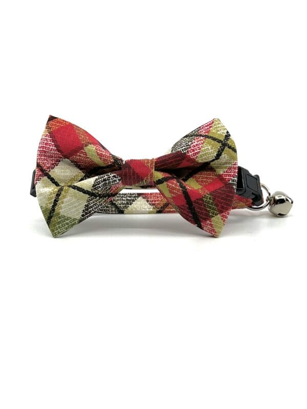 A red and white plaid bow tie with bell.
