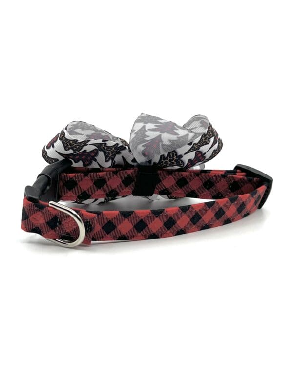 A red and black plaid dog collar with a bow tie.
