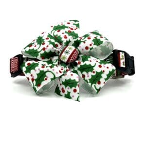A bow tie that is decorated with christmas holly.