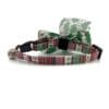 A cat collar with a bow tie and a bell.