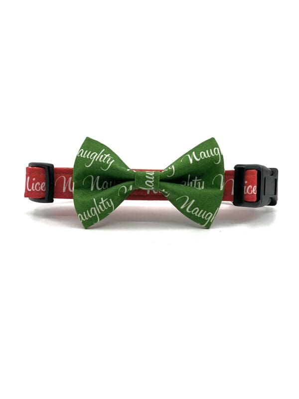 A bow tie that says naughty and merry christmas.