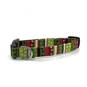 A dog collar with a red, green and white pattern.