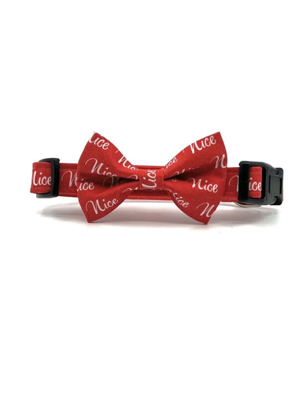 A red bow tie with the word nice written on it.