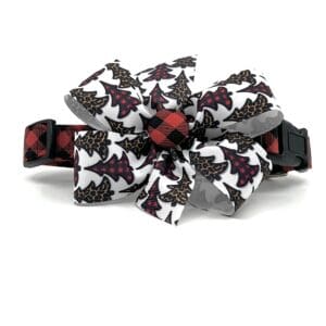 A black and red plaid dog collar with a bow.