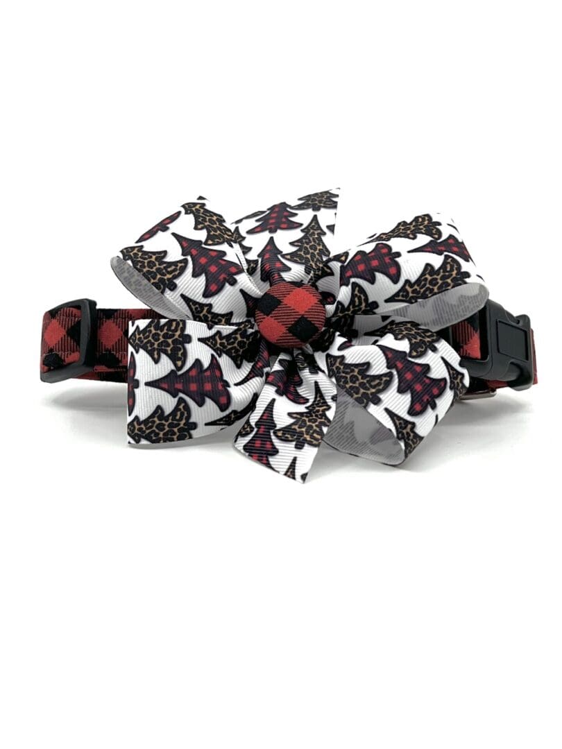 A black and red plaid dog collar with a bow.