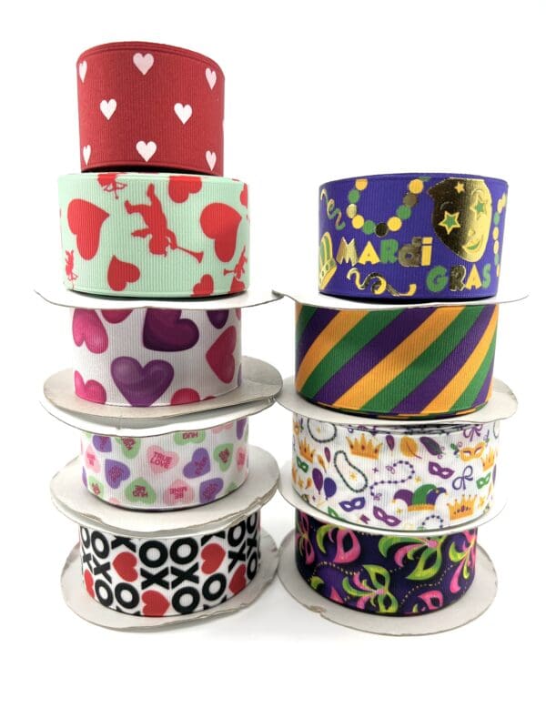 A stack of ribbons with various designs on them.