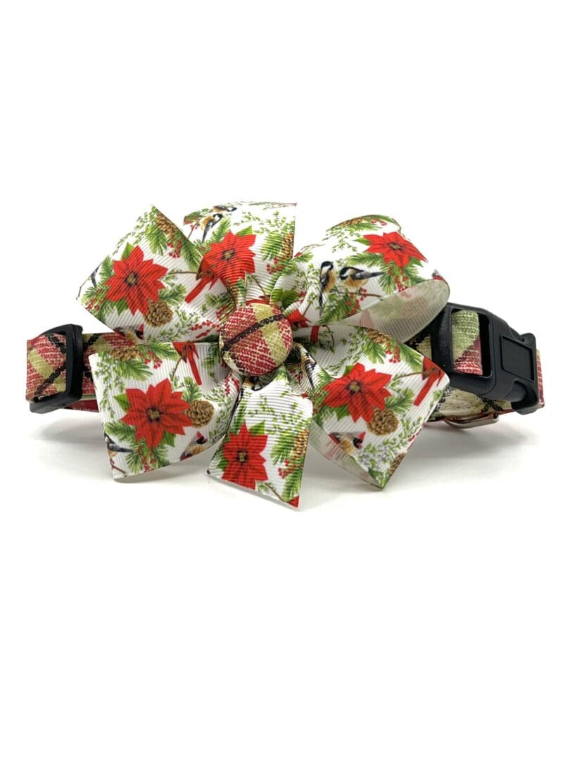 A bow that is made of fabric and has flowers.