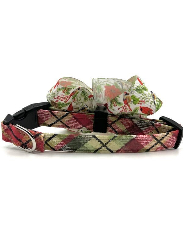 A dog collar and bow tie with flowers on it.