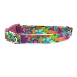 A colorful dog collar with flowers on it.