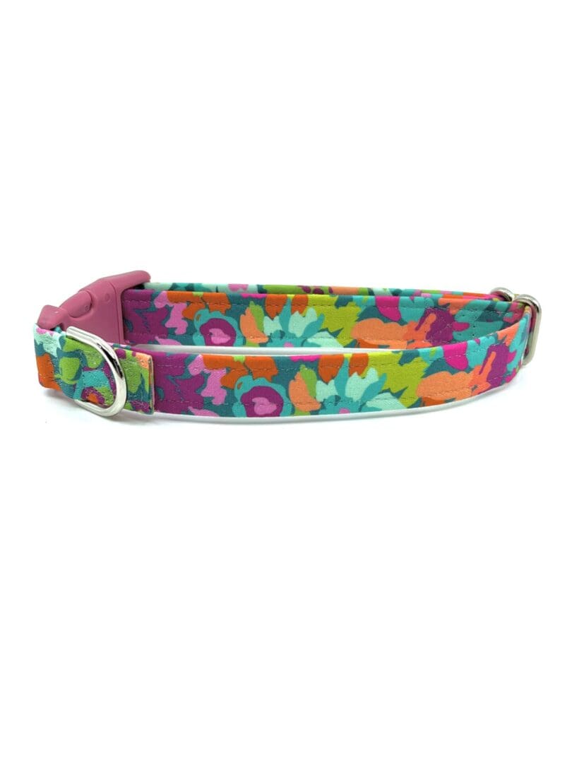 A colorful dog collar with flowers on it.