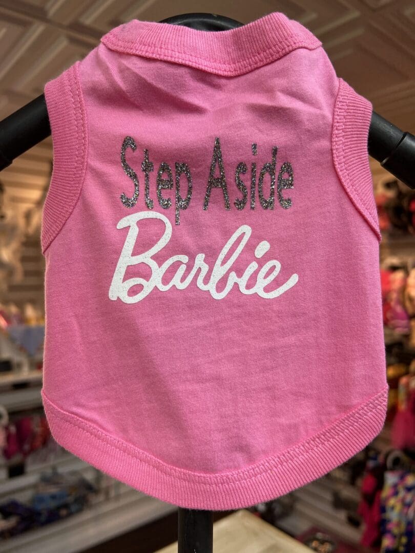 A pink tank top with the words step aside barbie on it.