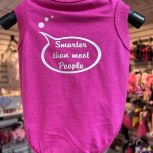 A pink shirt with the words smarter than most people written on it.