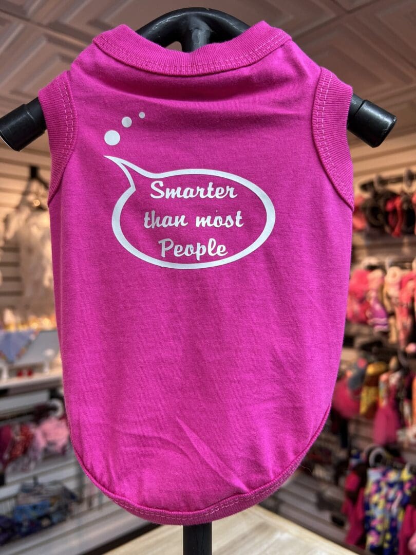 A pink shirt with the words smarter than most people written on it.