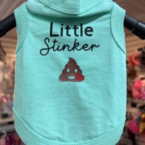 A little stinker dog shirt is shown on display.