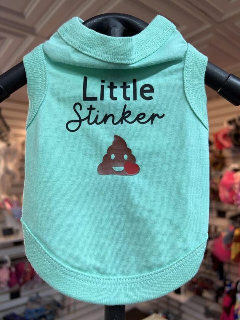 A little stinker dog shirt is shown on display.