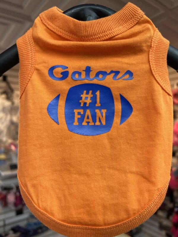 A dog shirt that says gators number one fan