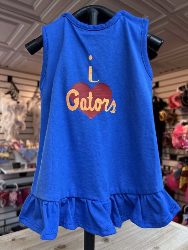 A blue dress with the words " i love gators ".