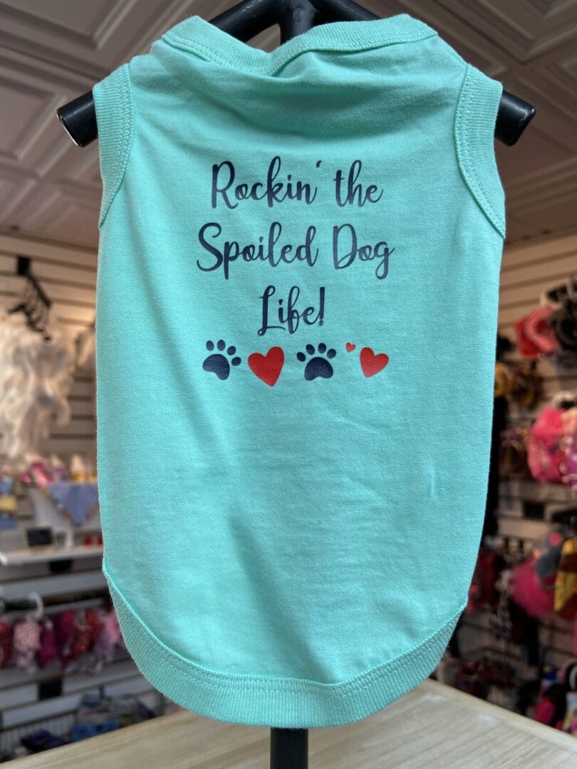 A dog shirt that says " rockin the spoiled dog life ".
