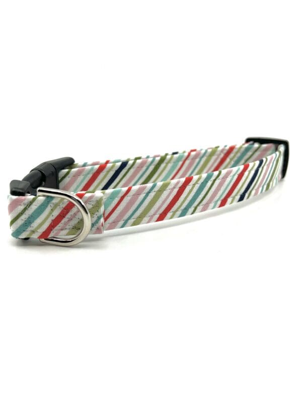 A dog collar with colorful stripes on it.