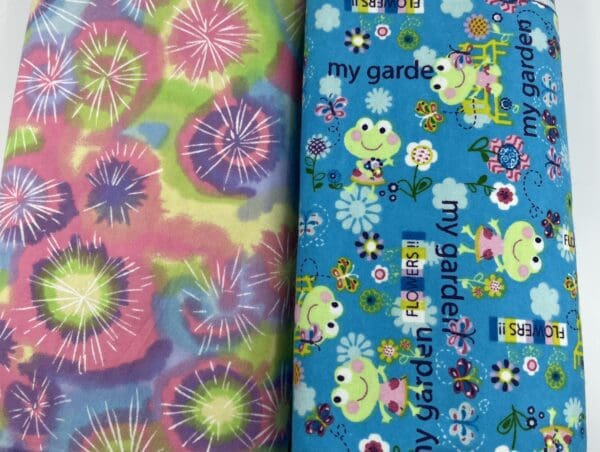 Two different fabrics with a frog and flower design.