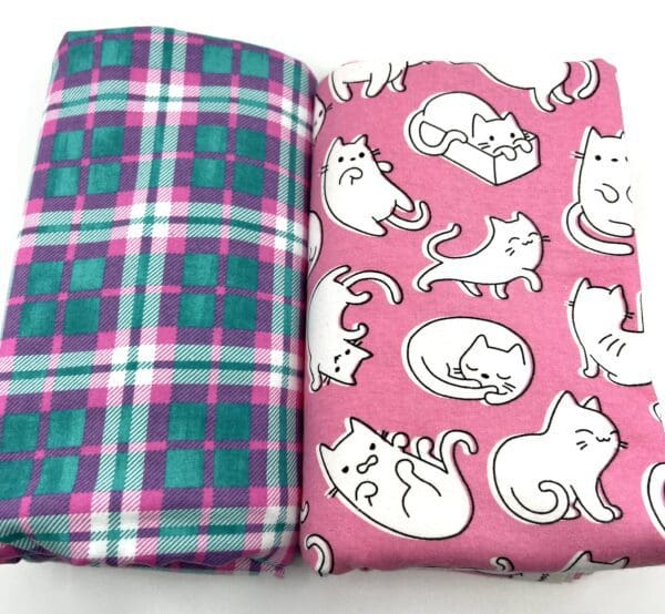 A pair of fabrics with cats on them