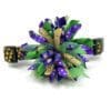 A purple and green flower with gold accents.