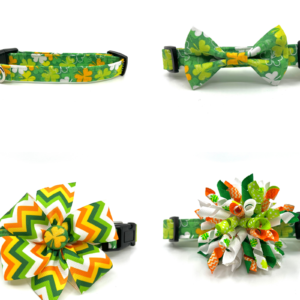 A collection of four different colored bows and ties.