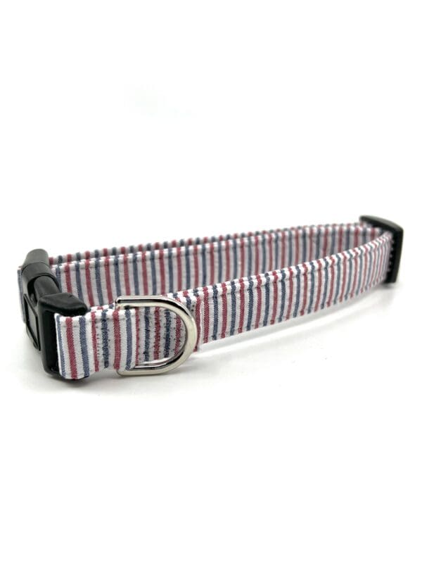 A dog collar that is pink and blue.