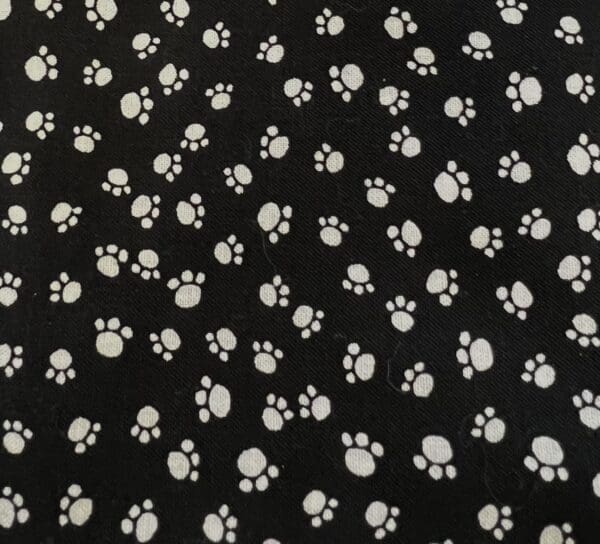 A black and white pattern of paw prints.
