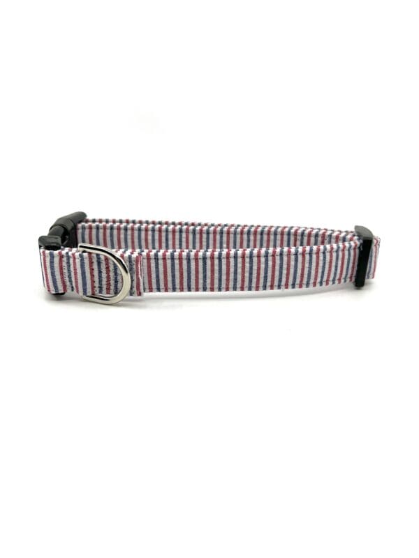 A dog collar that is pink and blue.