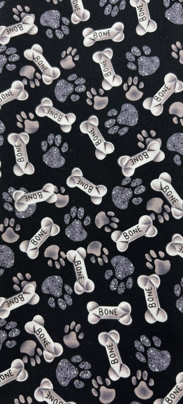 A black and white dog paw print fabric with bone prints.