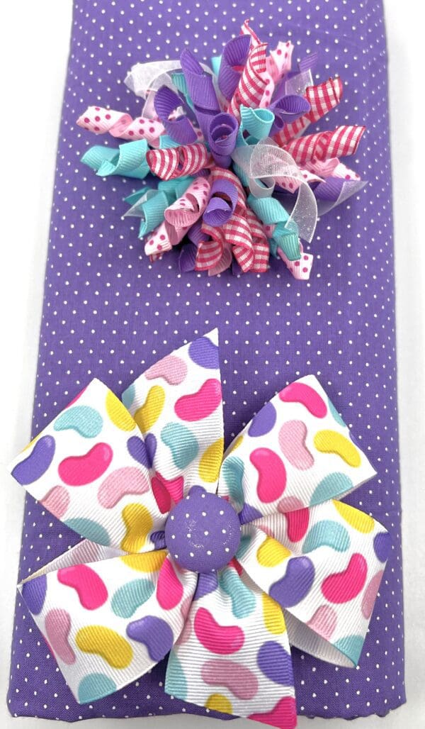 A purple gift wrap with colorful bows and polka dots.