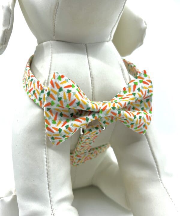 A dog wearing a bow tie with sprinkles on it.