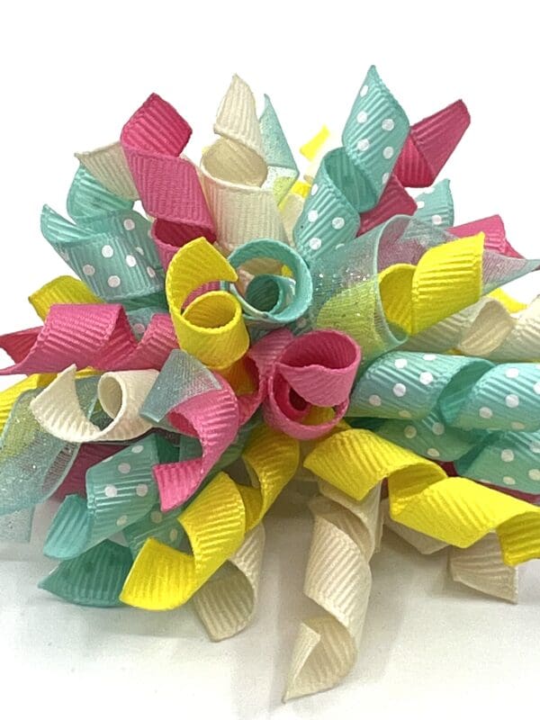 A bunch of ribbons that are in the shape of flowers.