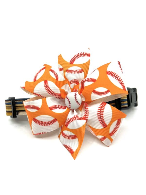 A hair clip with baseball fabric is shown.