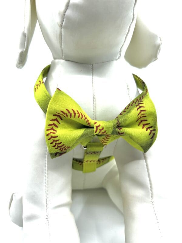 A bow tie with a softball pattern on it.