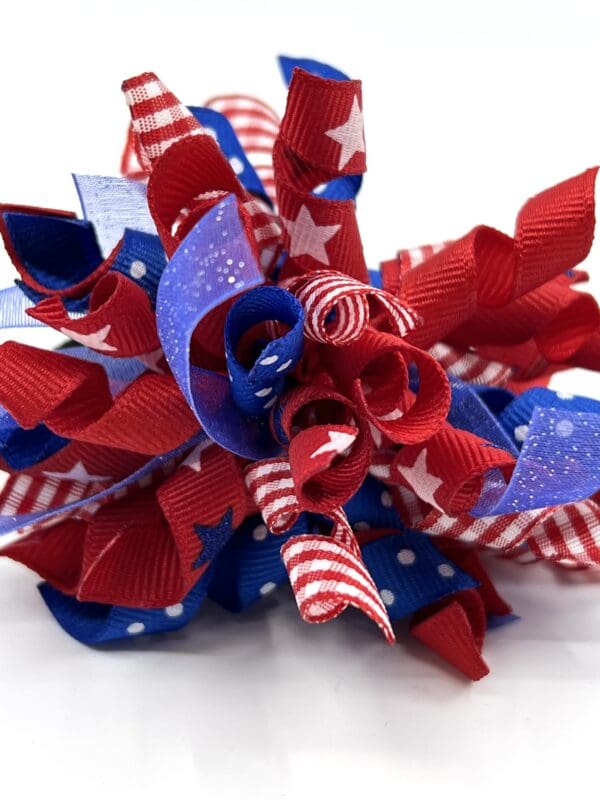 A red, white and blue bow with stars.