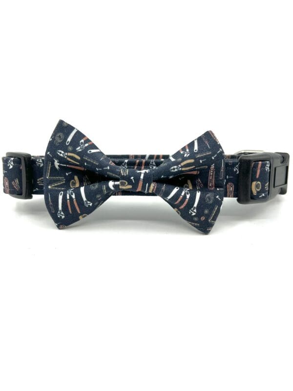 A dog collar with a bow tie on it.