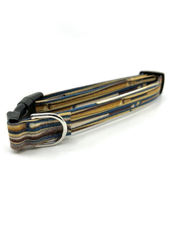A brown and black striped dog collar with metal buckle.